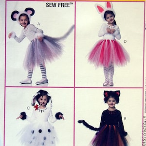 May include: A sewing pattern featuring four children's costumes: a mouse, a bunny, a dalmatian, and a cat. Each costume includes a headpiece, a top, and a tutu skirt. The costumes are in various colors, including white, gray, pink, black, and purple. The text "SEW FREE" is visible.