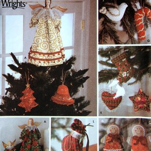 May include: A collection of handmade Christmas ornaments featuring a variety of designs, including angels, bells, stockings, stars, and candy canes. The ornaments are made from fabric and embellished with beads, sequins, and other decorative elements.