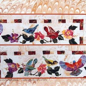 May include: A decorative quilt panel with a bird and floral design. The panel features a blue warbler, red bunting, and an Indian roller bird. The text reads "Feather & Song" and "Top Border".