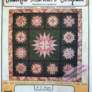 May include: A quilt pattern for a "Stacked Mariner's Compass" quilt. The pattern features a compass rose design with a green background and pink and white fabric. The pattern is called "Medallion version" and includes multiple variations. The text "supply sheets attached to back of cover photos" is visible in the lower right corner.
