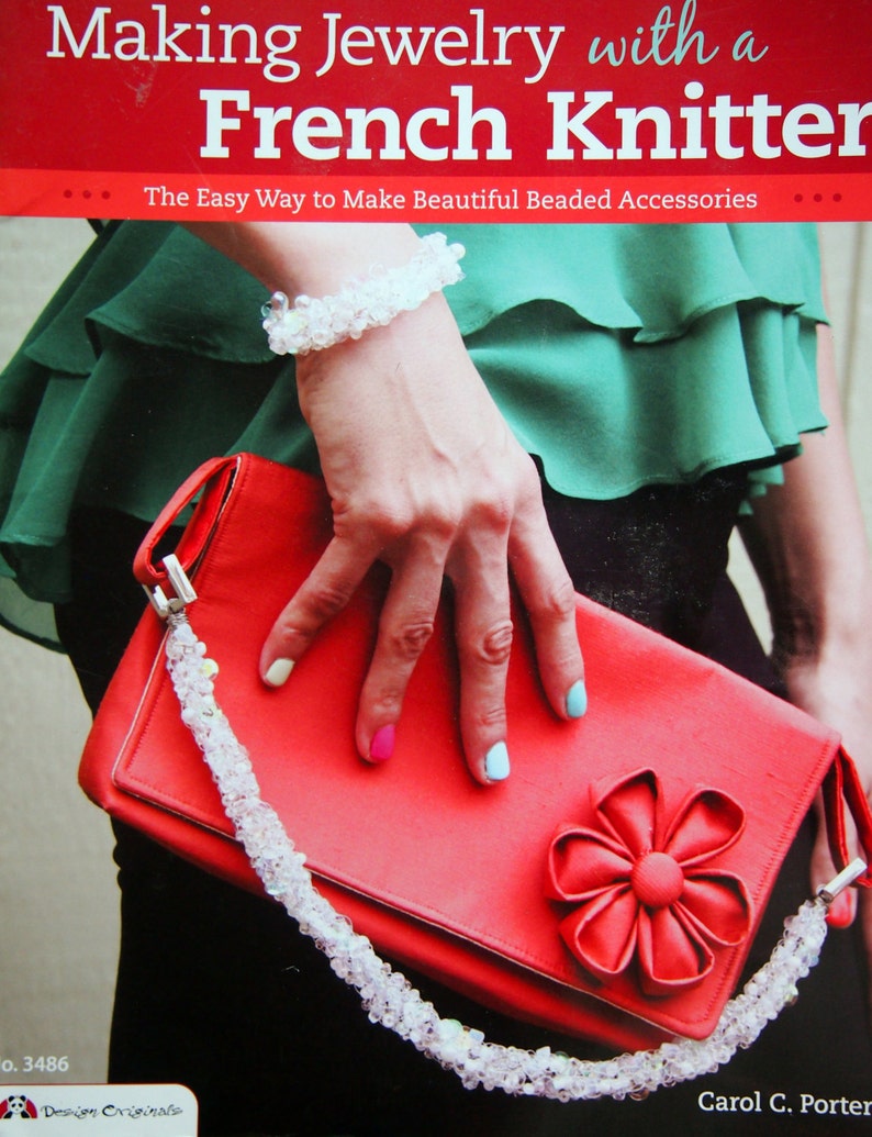 May include: A red clutch purse with a large red flower embellishment. The purse has a white beaded strap. The book cover text reads "Making Jewelry with a French Knitter. The Easy Way to Make Beautiful Beaded Accessories."