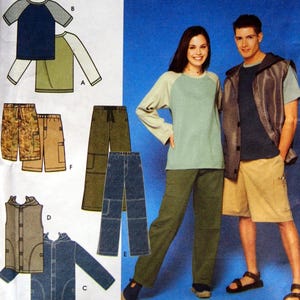 May include: Clothing pattern featuring various casual outfits. Includes raglan sleeve shirts, cargo pants, shorts, a vest, and a denim jacket. The color palette consists of blues, greens, tans, and camouflage prints. The outfits are modeled on a blue background.