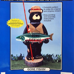 May include: A wooden craft kit featuring a black bear holding a fish with the words "Gone Fishing" on it. The kit requires a transfer paper, which is not included.