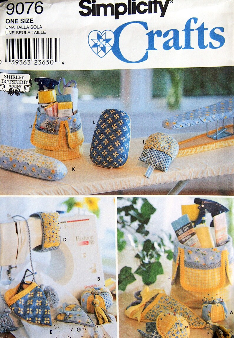 May include: Simplicity Crafts pattern 9076. The image shows various sewing accessories, including a sewing machine cover, pincushions, and a storage caddy. The accessories feature yellow and blue floral patterns. The pattern includes the text "ONE SIZE".