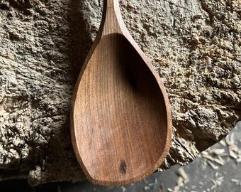 Hand carved right handed wooden cooking spoon