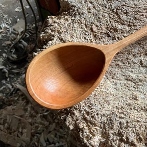 Hand carved wooden serving ladle