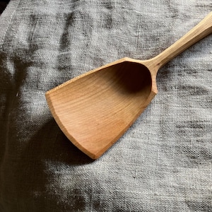 Hand carved wooden serving spoon
