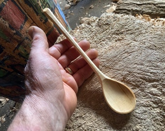 Hand carved cooking and eating spoon