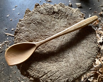 Hand carved left handed cooking spoon