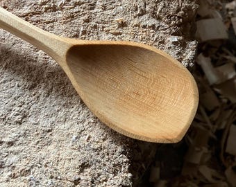 Hand carved right handed wooden cooking spoon, eleven inches long