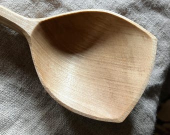 Hand carved wooden serving spoon, nine inches long