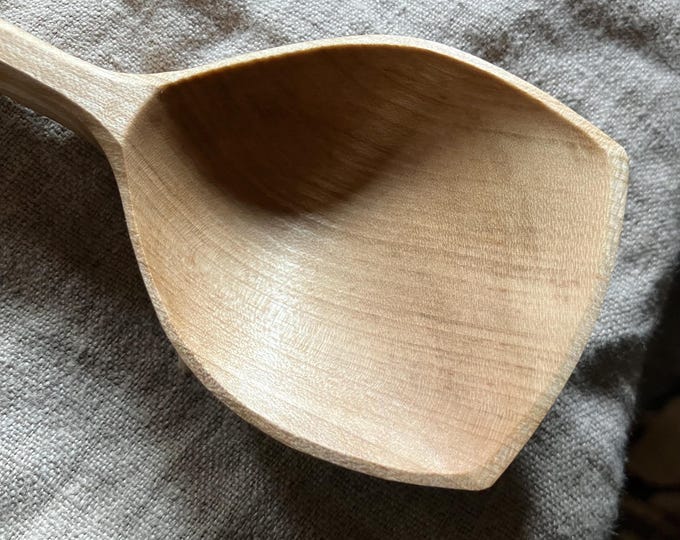 Featured listing image: Hand carved wooden serving spoon, nine inches long