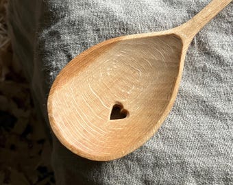 Hand carved left handed cooking spoon