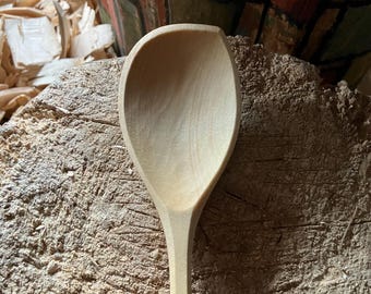 Hand carved right handed wooden cooking spoon, twelve inches long