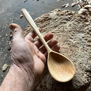 Hand carved wooden serving spoon