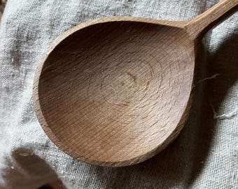 Hand carved wooden serving spoon, twelve inches long