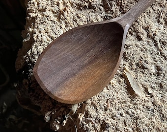 Hand carved right handed wooden cooking spoon
