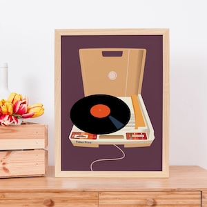 May include: A framed print of a vintage record player with a black vinyl record on the turntable. The record player is white with orange accents and the text "Thorens" is visible on the front. The print has a purple background.