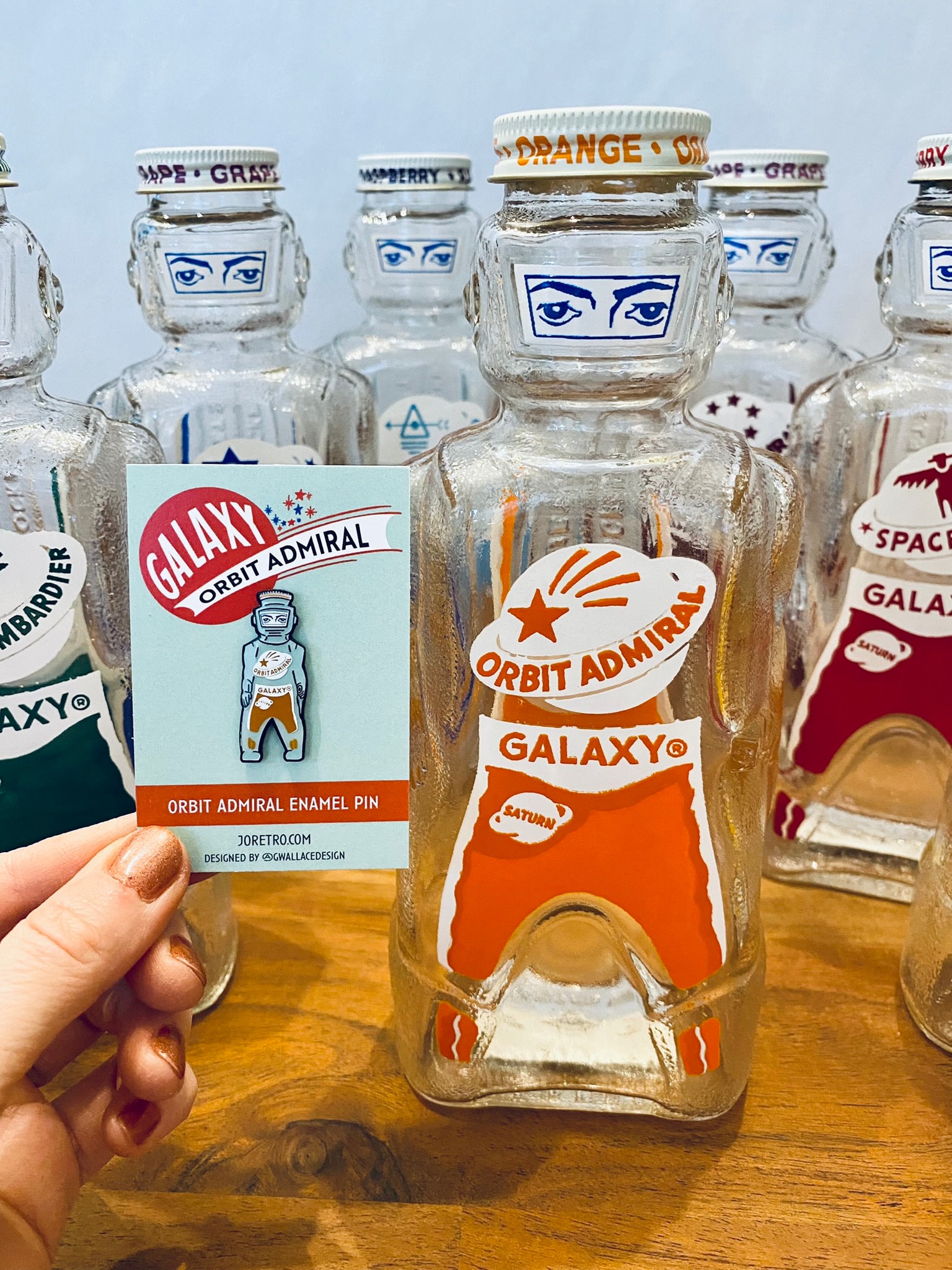 Galaxy Spaceman Syrup Bottle Enamel Pin - 2 Colors - Orange Orbit