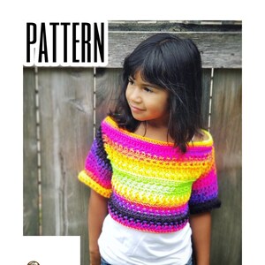 May include: A rainbow crochet top with short sleeves. The top has a wide, off-the-shoulder neckline and is made with a variety of colourful yarns. The top is worn by a child standing in front of a wooden fence. The text "PATTERN" is visible in the top left corner of the image.