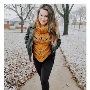 May include: A woman wearing a mustard yellow crochet cowl neck top with a black leather jacket and black leggings. The top has a lacy pattern and is crocheted in a triangular shape. The text "CELINE crochet pattern serendipity-as-always.com" is at the bottom of the image.