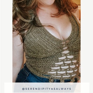 May include: A crochet top with a dragonfly design. The top is brown and has a cutout pattern. The top is worn over a pair of blue jeans. The text "@serendipityasalways" is at the bottom of the image. The text "Dragonfly Top" is in a larger font and the text "Crochet Pattern PDF Digital Download" is in a smaller font.