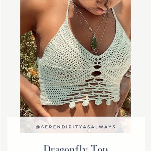May include: A crochet top with a dragonfly design. The top is light green and has a scalloped hem. The top is worn by a person with dark skin and long, dark hair. The text "@serendipityasalways" is visible at the bottom of the image.