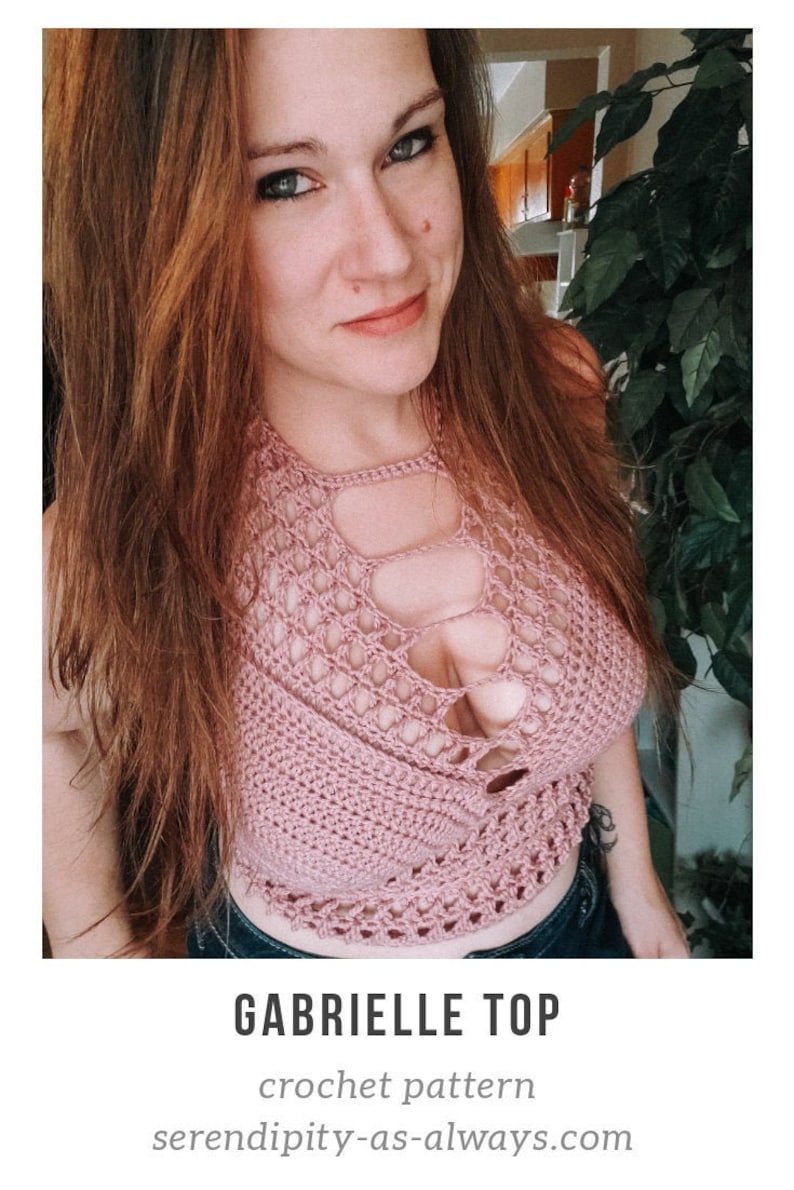 May include: A close-up of a woman wearing a pink crochet top with a cut-out design. The top is crocheted with a delicate pattern and has a relaxed fit. The text "GABRIELLE TOP crochet pattern" and "serendipity-as-always.com" is visible below the image.