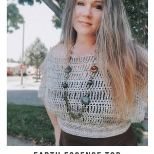 May include: A woman wearing a crocheted off-the-shoulder top with a brown and green stone necklace. The top is a light beige colour and has a loose, flowy fit. The text "EARTH ESSENCE TOP" and "crochet pattern" is visible below the image. The website address "serendipity-as-always.com" is also visible.
