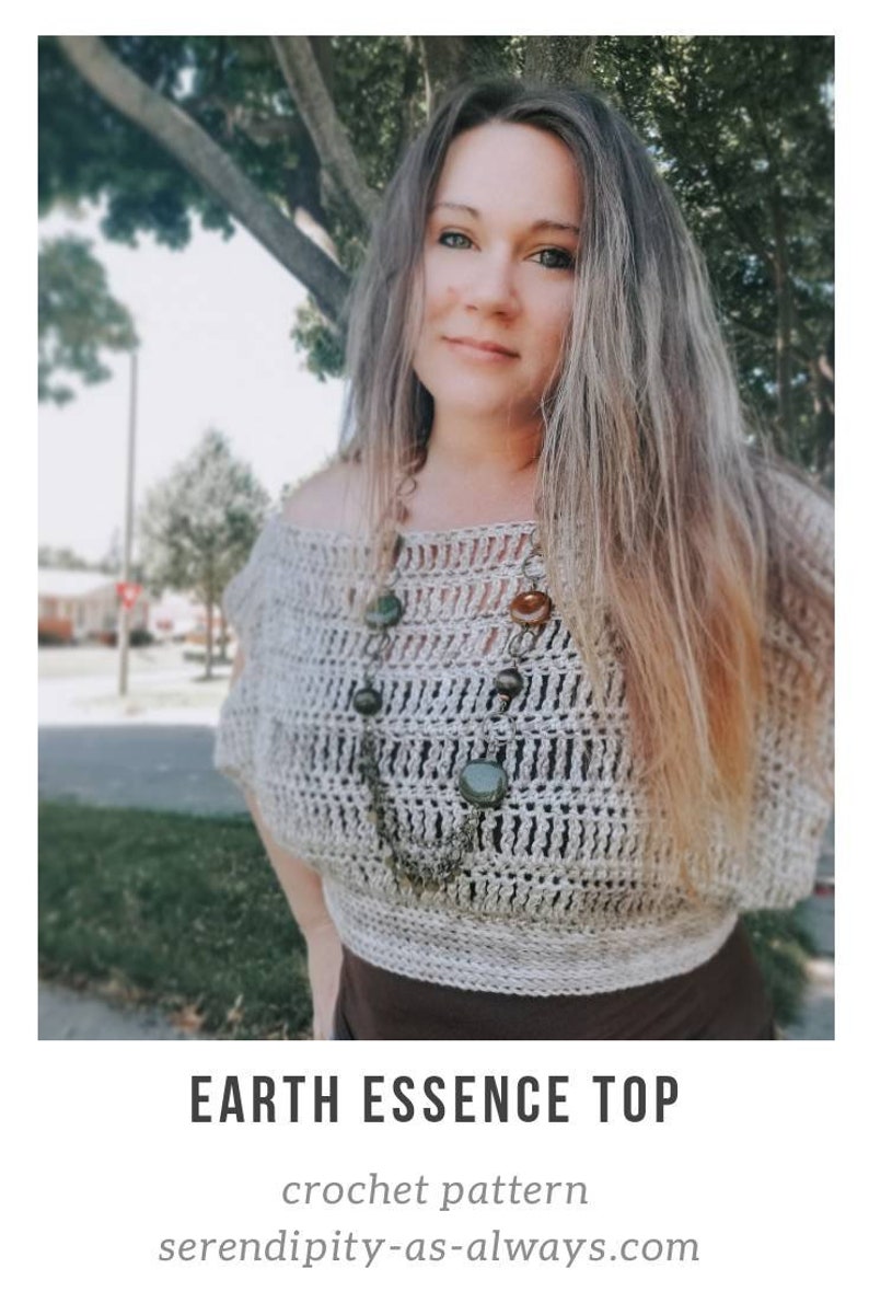 May include: A woman wearing a crocheted off-the-shoulder top with a brown and green stone necklace. The top is a light beige color and has a loose, flowy fit. The text "EARTH ESSENCE TOP" and "crochet pattern" is visible below the image. The website address "serendipity-as-always.com" is also visible.