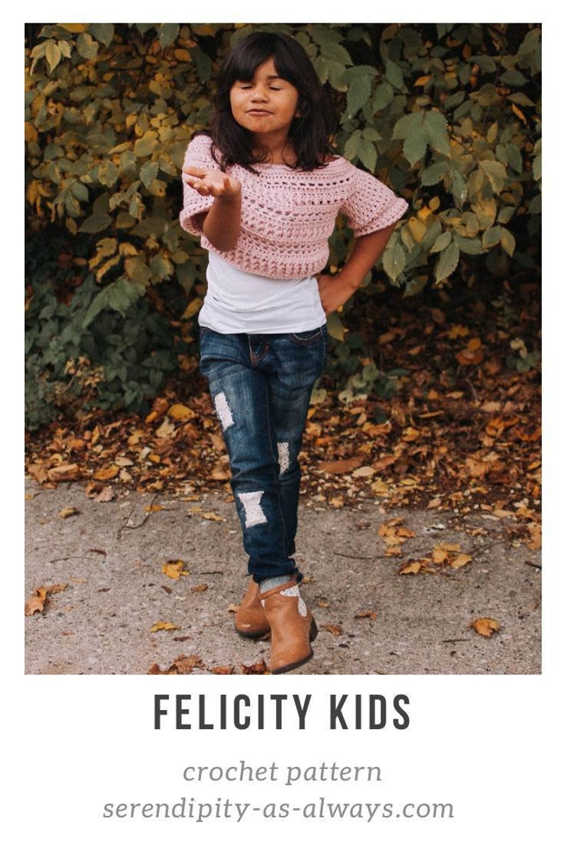 May include: A pink crochet top with short sleeves and a slightly off-the-shoulder neckline. The top is being worn by a child standing in a park setting. The text "FELICITY KIDS crochet pattern serendipity-as-always.com" is visible at the bottom of the image.