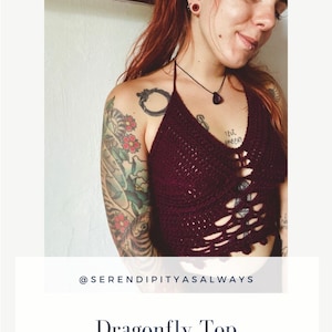 May include: A woman wearing a burgundy crochet top with a dragonfly design. The top has a halter neckline and a cropped length. The woman has a tattoo on her arm. The text "Dragonfly Top" and "Crochet Pattern PDF Digital Download" is displayed below the image.