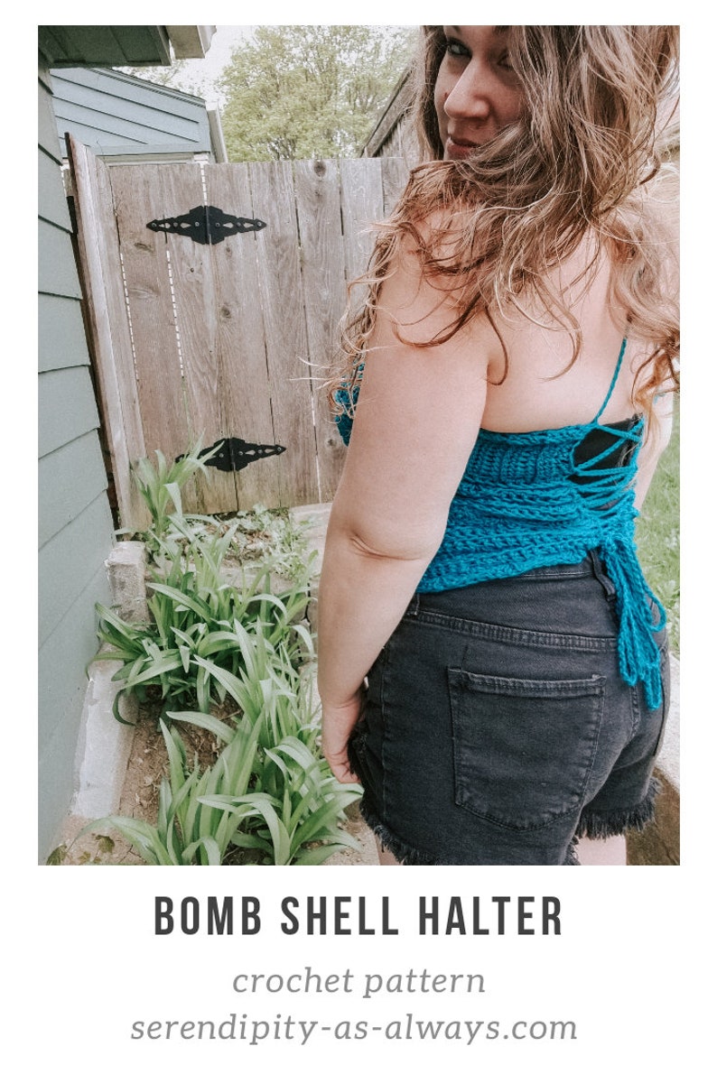 May include: A teal blue crochet halter top with a lace-up back. The top is worn by a person with long brown hair. The top is made with a shell stitch pattern.