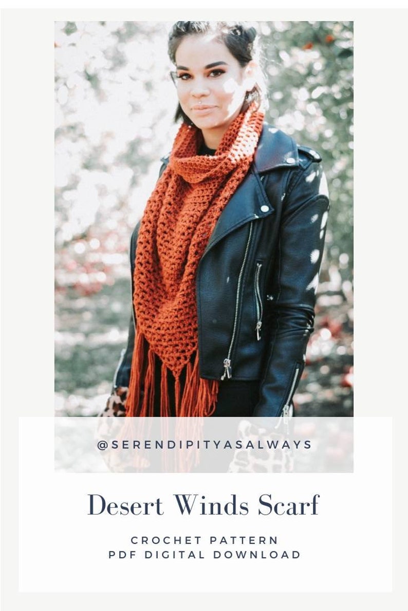 May include: A woman wearing a black leather jacket and a rust-colored crochet scarf with fringe. The scarf is a triangle shape and has a crocheted pattern. The text "@serendipityasalways" is below the image. The text "Desert Winds Scarf" is below the text "@serendipityasalways". The text "Crochet Pattern" is below the text "Desert Winds Scarf". The text "PDF Digital Download" is below the text "Crochet Pattern".