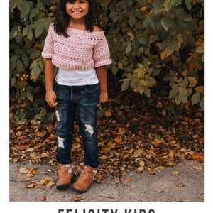 May include: A young girl wearing a pink crochet top with a white undershirt, blue jeans, and brown boots. The girl is standing in front of a bush with brown leaves on the ground. The image includes the text "FELICITY KIDS crochet pattern serendipity-as-always.com".