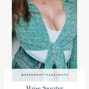 May include: A teal blue crochet sweater tied at the waist. The sweater is shown on a model wearing a white tank top and blue jeans. The text "@serendipityasalways" and "Maise Sweater Crochet Pattern PDF Digital Download" is displayed below the image.