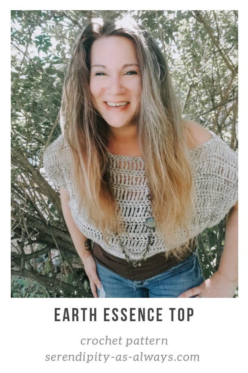 May include: A woman wearing a crocheted top with a brown belt and blue jeans. The top is a light beige color and has a loose, flowing fit. The text "EARTH ESSENCE TOP" and "crochet pattern" is visible below the image. The website address "serendipity-as-always.com" is also visible.