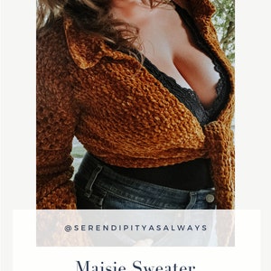 May include: A crocheted sweater in a rust color with a tie front. The sweater is worn over a black lace bralette and blue jeans. The text "@serendipityasalways" and "Maisie Sweater Crochet Pattern PDF Digital Download" is displayed below the image.