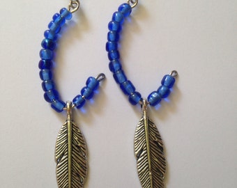 Nayeli's Beautiful Blue Curved Earrings With Feathers