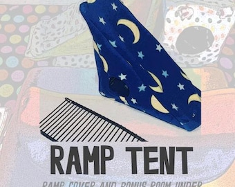 May include: A blue ramp tent with a celestial pattern of yellow moons and white stars. The text "RAMP TENT" is displayed in bold, dark gray letters, with the text "RAMP COVER AND BONUS ROOM UNDER" below it.