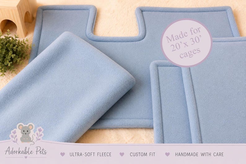 May include: Light blue fleece cage liners, custom-fit for 20" x 30" cages. The soft, handmade liners are designed for small pets. The image includes the text "Adorkable Pets", "Ultra-Soft Fleece", "Custom Fit", and "Handmade with Care".