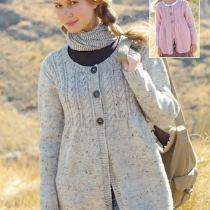 May include: A light gray, long-sleeved cardigan with a cable knit design and large brown buttons. The cardigan is worn over a black top and paired with blue jeans. A smaller image shows a pink cardigan.