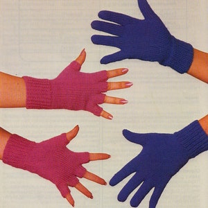 May include: Two pairs of fingerless gloves, one pair is pink and the other is blue. The gloves are knitted and have a simple design.