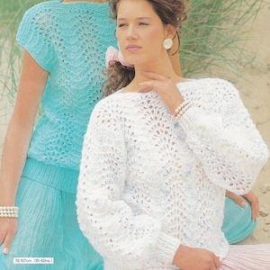 May include: A white, open-knit sweater with long sleeves and a round neckline. The sweater features a delicate, fan-like pattern. A light blue, short-sleeved top with a similar pattern is also visible. The image includes the text "76-107cm. (30-42ins.)".