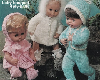 May include: Three dolls wearing knitted baby clothes. The dolls are dressed in a pink dress and bonnet, a white coat with a fur-trimmed hood, and a blue outfit with a hat. The text on the image reads: 12-18 ins, 30-45.5 cm, baby bouquet, 4 ply & DK.