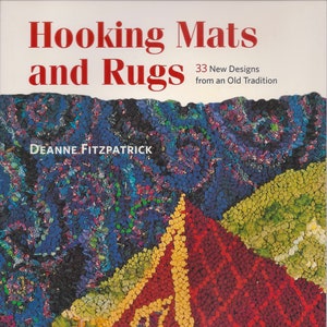 May include: Book cover with the title "Hooking Mats and Rugs" in red text. The subtitle is "33 New Designs from an Old Tradition". The author's name is "Deanne Fitzpatrick". The cover features a close-up of a colorful hooked rug.