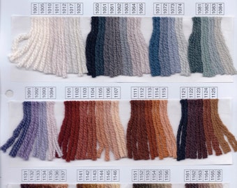 May include: A color chart of yarn samples, labeled with numbers from 1001 to 1166. The yarn samples are arranged in rows of 15, with each row featuring a different color palette. The colors range from white and cream to deep browns and greens.