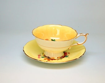 B5120 - Vintage Paragon Tea Cup and Saucer with Flowers on Yellow - Made in England