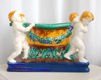 B4107 - Four Nude Children Carrying a Floral Decorated Vessel