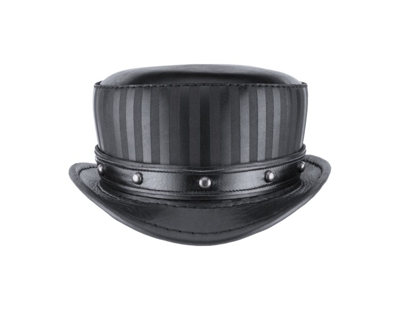 May include: A black leather top hat with a striped band and silver studs around the brim.